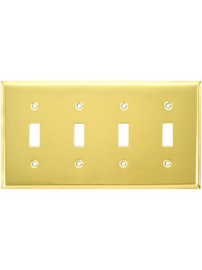 Classic Four Gang Toggle Switch Plate In Polished Brass Finish.